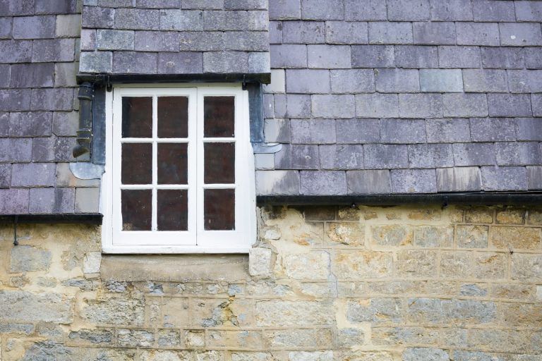 Old Cottage With Stone Walls And Dormer Window In Slate Roof, Uk